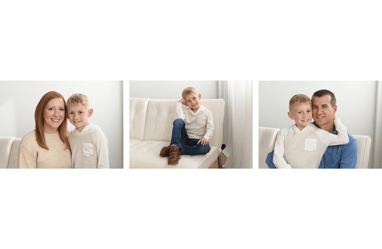An elementary school aged boy is all smiles with his mother and father at Kliks Photography.