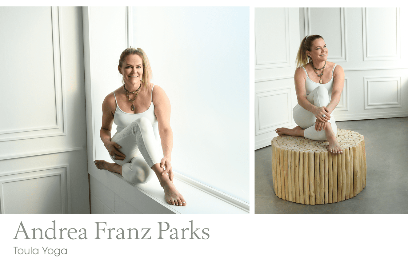 A female yoga instructor in a white tank and leggings posing causally for her studio website.