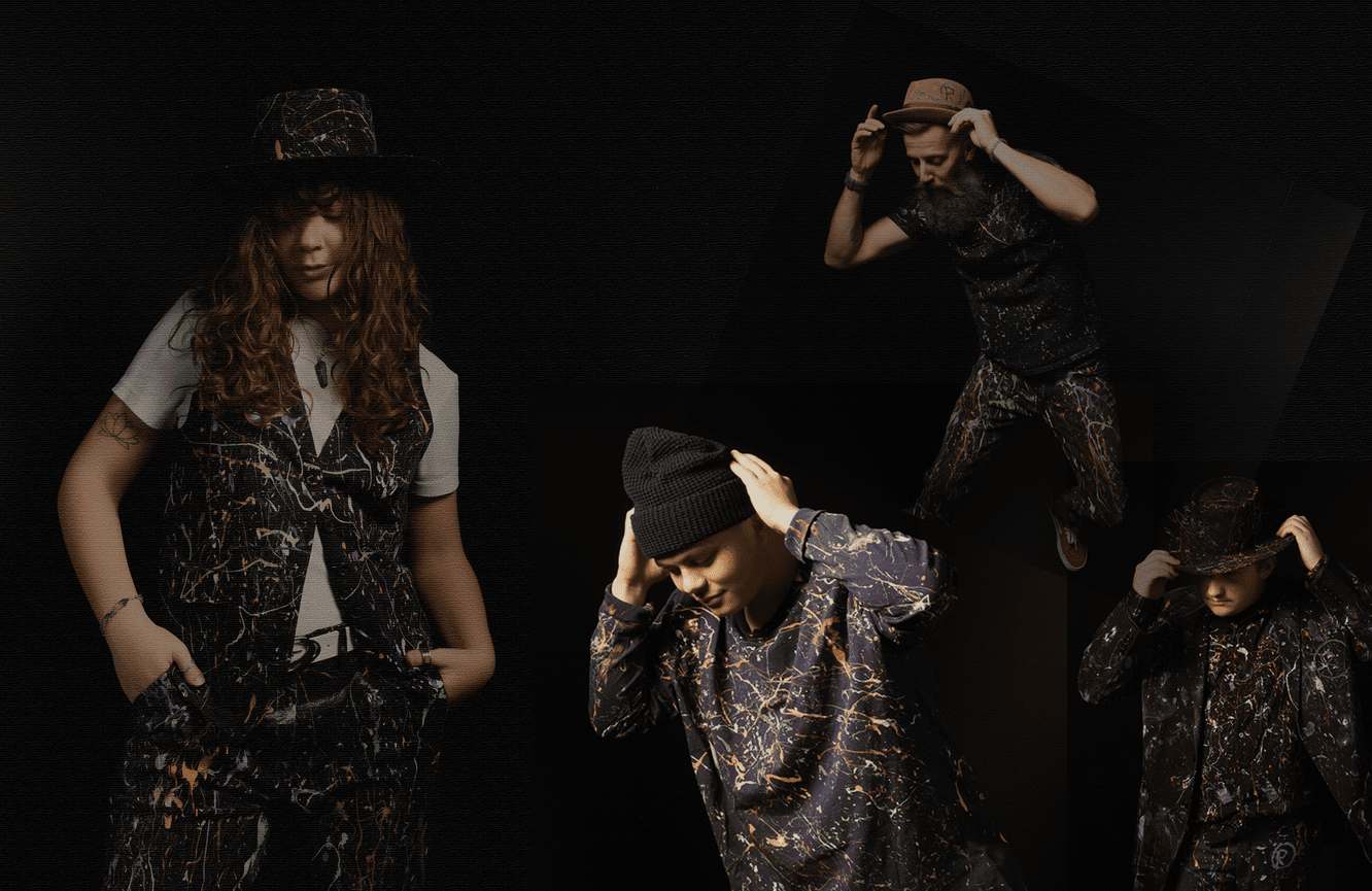 A creative collage of three men and a woman all wearing clothes and hats that have been smattered in paint for a fashion show.