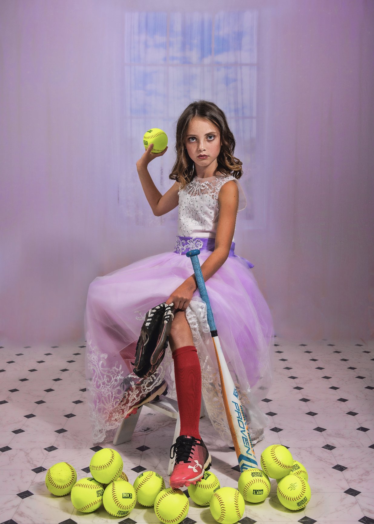 tween with softballs in gown and tiara